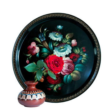 zhostovo tray and red rose in vase isolated on white