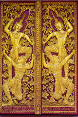 Ornament wooden door of Thai temple in Chiangmai, Thailand