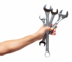 Hand of auto mechanic with wrench.