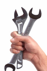 Hand of auto mechanic with wrench.