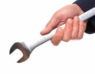 Hand of auto mechanic with wrench.