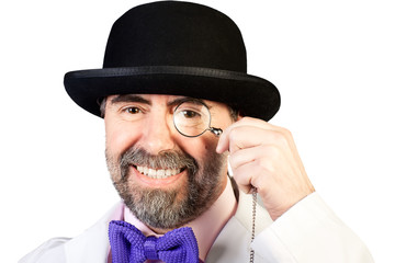 Portrait of happy middle-aged man in a hat with a monocle in his