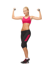 young sporty woman with light dumbbells