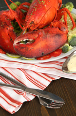 Red lobster on platter on table close-up