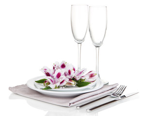 Festive table setting with flowers isolated on white