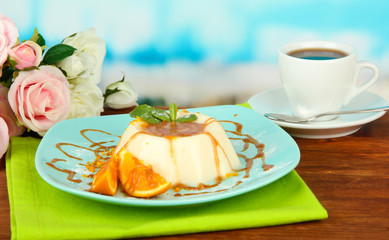 Panna Cotta with orange zest and caramel sauce,