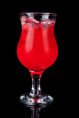 red alcholol cocktail isolated on black in hurricane