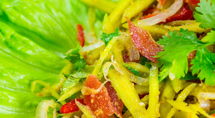 Close  up view home made Thai mango fruit salad, Somtam.