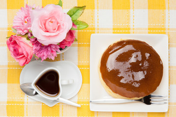 artificial flowers and coffee and cheesecake