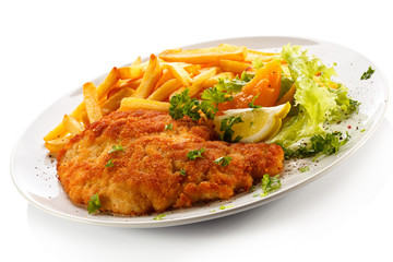 Pork chop, French fries and vegetables