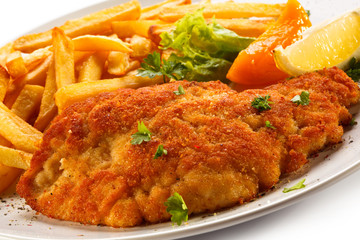 Pork chop, French fries and vegetables