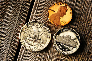 US cent coins over wooden background