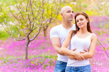 Loving couple on floral field