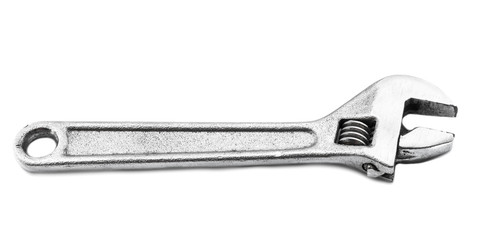 Old adjustable spanner on white background.