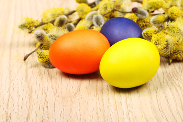 Obraz na płótnie Canvas Easter eggs on a wooden surface