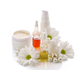 Fototapeta na wymiar natural cosmetics products with pearls and flowers