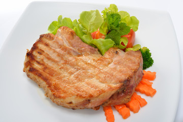 Grilled pork steak with vegetables