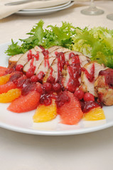 Sliced ​​baked fillet with cranberry sauce