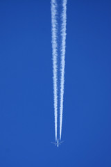 airplane and vapour trail