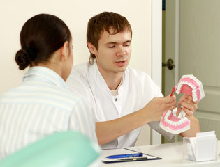 Fototapeta premium Portrait of handsome young dentist teaching