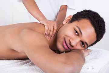 Fototapeta na wymiar Man Receiving Massage From Female Hand