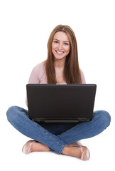 Young Woman Working On Laptop Over White Background