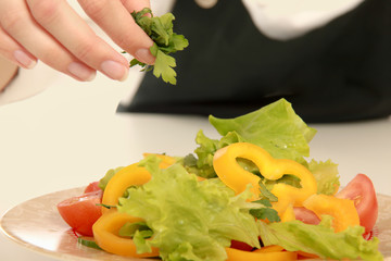 Portrait of a young cook in uniform preparing meal