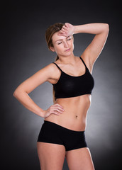 Fototapeta premium Portrait Of Young Woman Tired After Workout