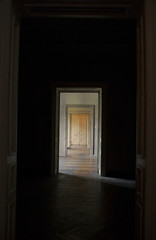 Closed door at the end of the hallway, rite of passage concept.