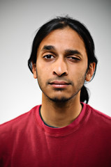 Obraz premium Young Indian Ethnic Man Raised Eyebrow Portrait