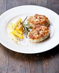 Fishcakes with french fries and herbs