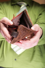 Empty wallet in male hands - poor economy
