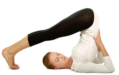 Obraz premium Young woman in black practicing yoga