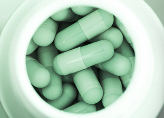 capsule in plastic bottle close up