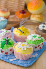 cup cakes with a lot of bread pastry background