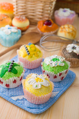 lemonade cup cakes with a lot of bread pastry background