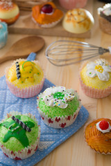 cup cakes with a lot of bread pastry background