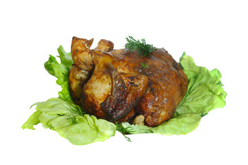 Whole roasted chicken with vegetables on a white plate