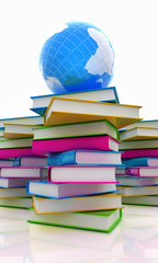 Colorful real books and earth on white background