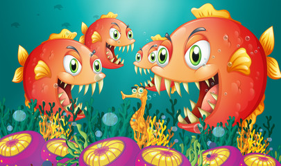 Fototapeta premium A seahorse surrounded by a group of hungry piranhas