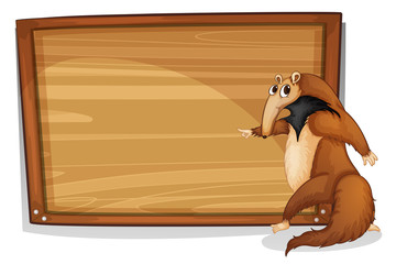 A wild animal beside an empty wooden board