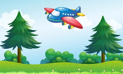 Fotobehang Een speelgoedvliegtuig dat boven de heuvel vliegt © GraphicsRF