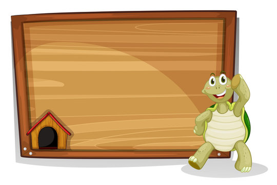 A turtle beside a wooden empty board