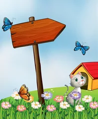 Abwaschbare Fototapete Schmetterling Ein Garten mit Schmetterlingen und einer Katze neben einem Pfeilbrett