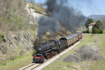 Steam train and little railway station