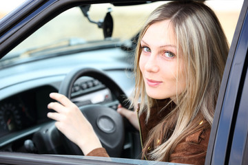 Fototapeta na wymiar girl driving car