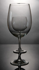 Empty wine glasses arranged on grey background