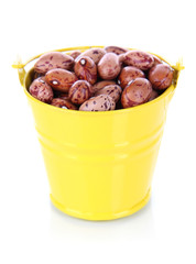 Bucket with beans isolated on white