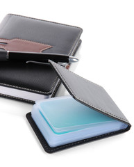 Black business card holder notebook and pen close-up