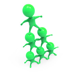 Little green men form a human pyramid